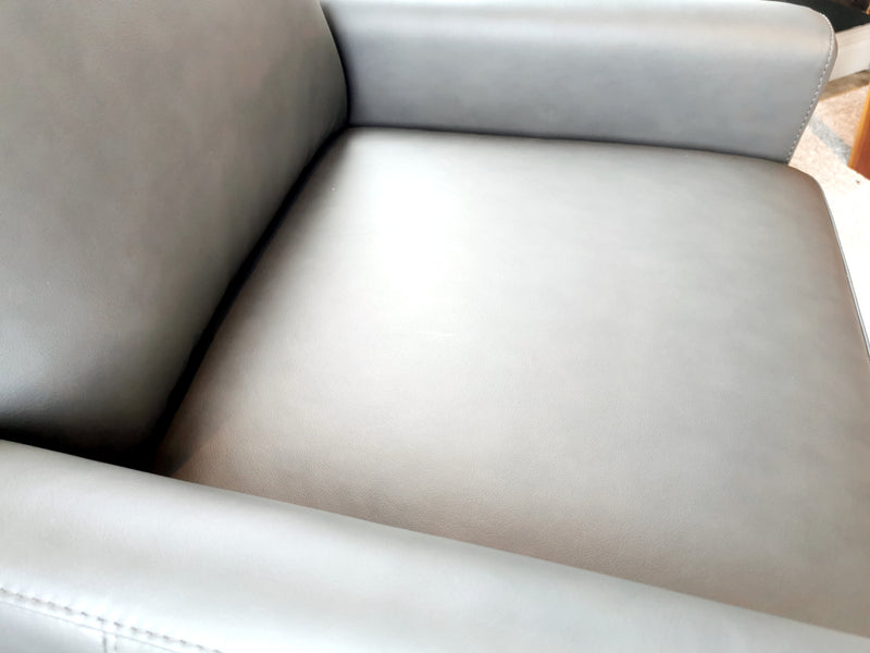 Close-up of the 733 Leather Swivel Chair by Leather Craft, showcasing smooth gray leather upholstery in Toronto.