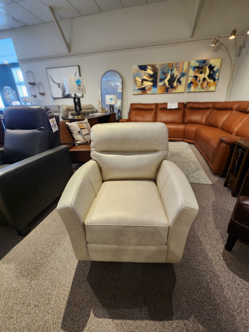 744 Leather Swivel Chair by Leather Craft, handmade in Toronto, shown with sofas in showroom.