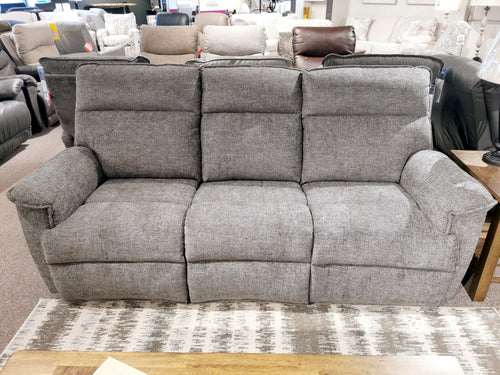 706 Jay Power Sofa by La-Z-Boy: gray three-seater with pillow-soft seats, showcased on a patterned rug among other furniture.
