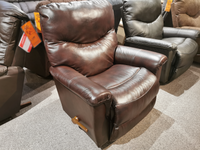 A La-z-boy 521 James Rocker Recliner with chaise legrest and wooden lever, shown on a carpeted showroom floor.