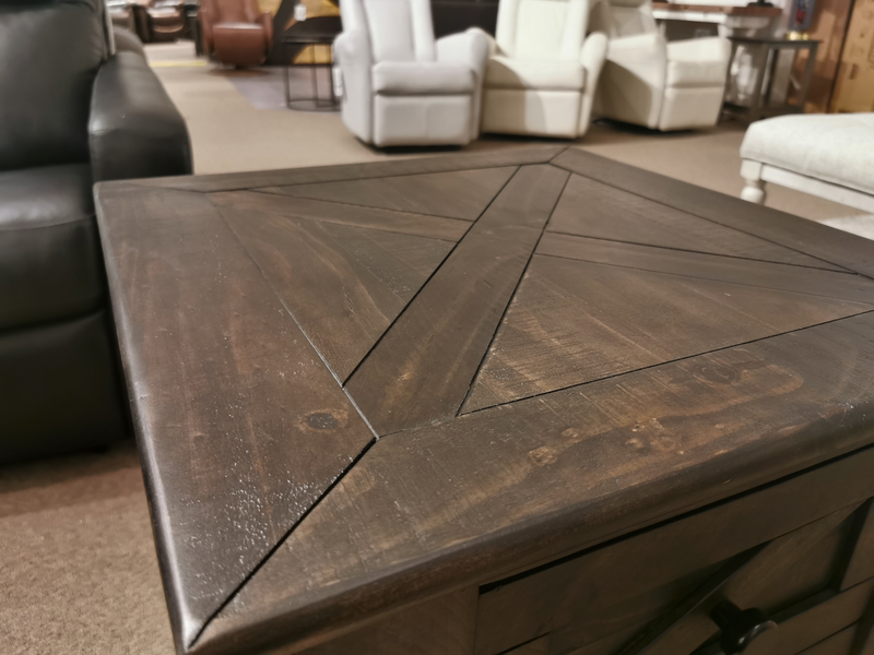 Magnussen 3778 Garrett Square End Table displayed with upholstered chairs in a showroom.