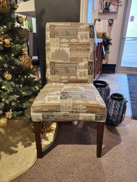 Best FS9800 Odell dining chair with a nature-themed pattern sits by a Christmas tree and black lanterns.