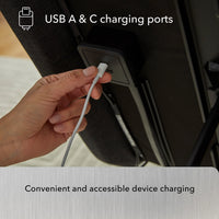 Plugging a USB-C cable into Beauty-Rest Platinum Adjustable Base with dual massage and USB-A & C charging ports.