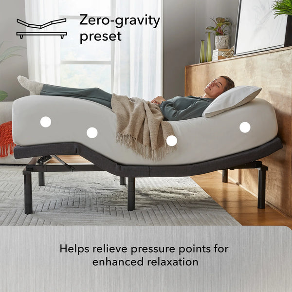 A person relaxes on the Beauty-Rest Platinum Adjustable Base, which highlights pressure points for enhanced comfort.