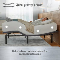 A woman relaxes on the Beauty-Rest Silver Adjustable Base in zero-gravity mode with pressure relief zones and wireless remote.