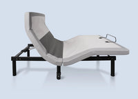 Flex LSX Queen Adjustable Base by Bed Gear with gray mattress, dual massage, semi-reclined on light blue background.