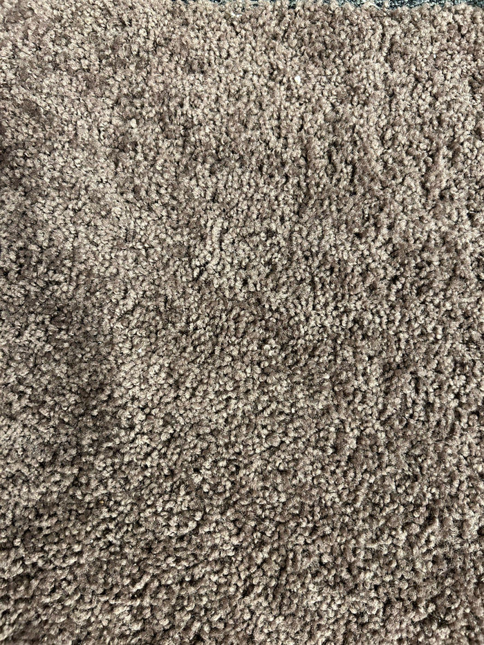 Close-up of textured Melmart Formal Carpet by Melmart Canada in beige with a fluffy, looped, chocolate chip speckled design.