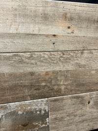 Close-up of CENTURA BARNWOOD SERIES tile by CENTURA, showing wood grain, knots, and natural color variations.