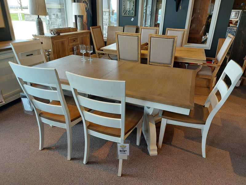 Magnussen D5164 Hutcheson 6 Piece Dining Set with six chairs displayed in showroom, price tag on table leg.