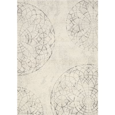 The Kalora Safi 7152/6513 is a beige machine-made rug with subtle gray circles, ideal for transitional spaces.