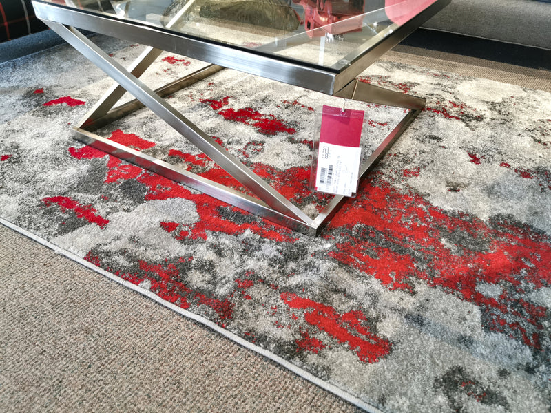 The Kalora Freemont A006/0323 adds modern style when placed under a glass coffee table with a metal frame.