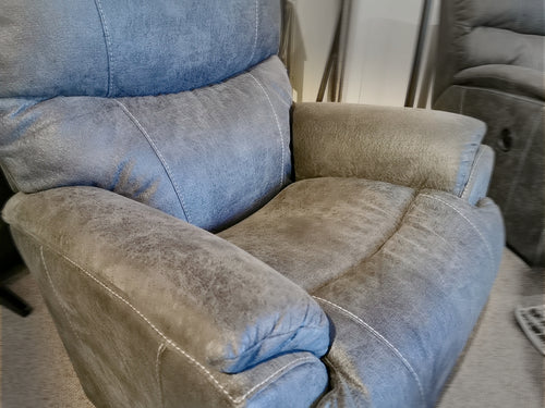 The 724 Trouper Rocker Recliner by La-Z-Boy offers lumbar support, plush gray fabric, and visible stitching in a room.