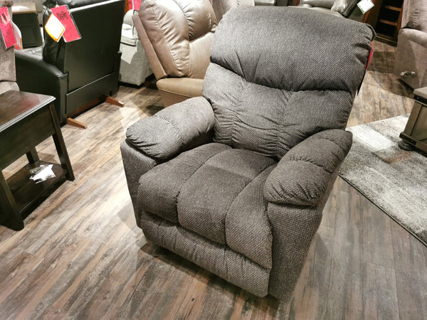 La-Z-Boy 766 Morrison Rocker Recliner in dark gray fabric, tufted back, shown on wooden floor among other chairs.