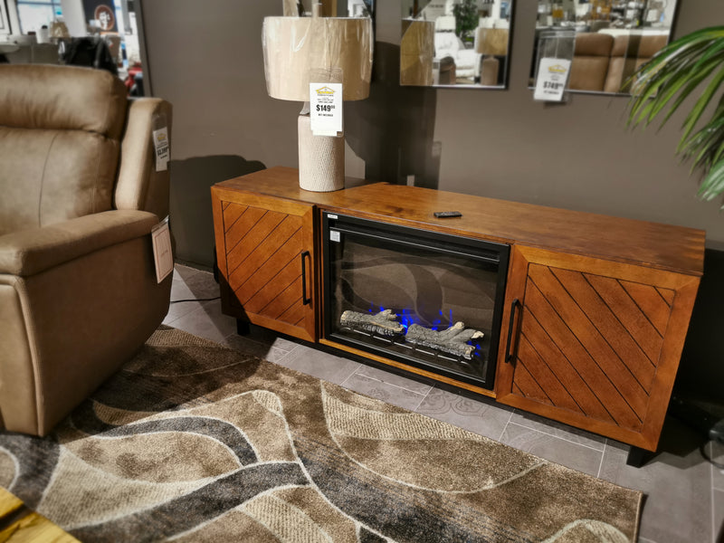 Rustic charm from Napoleon's Bella Mantel, featuring a Cineview 26 electric fireplace, decorative logs, and a cozy beige armchair.
