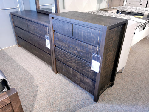 Two Meta Sequoia Cappuccino 5-Drawer Chests by Ruffsawn with distressed finish are displayed in a showroom.