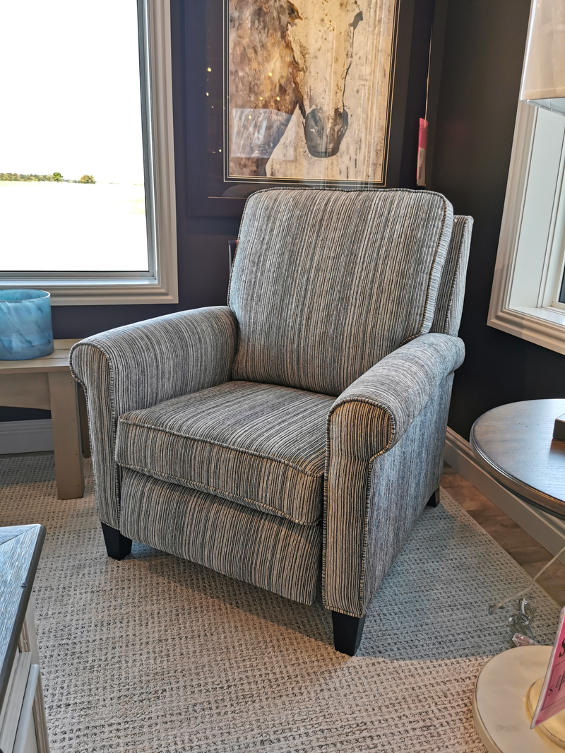 Superstyle 81 Reclining Chair with gray stripes on carpet, next to a window, side table, and wall art.